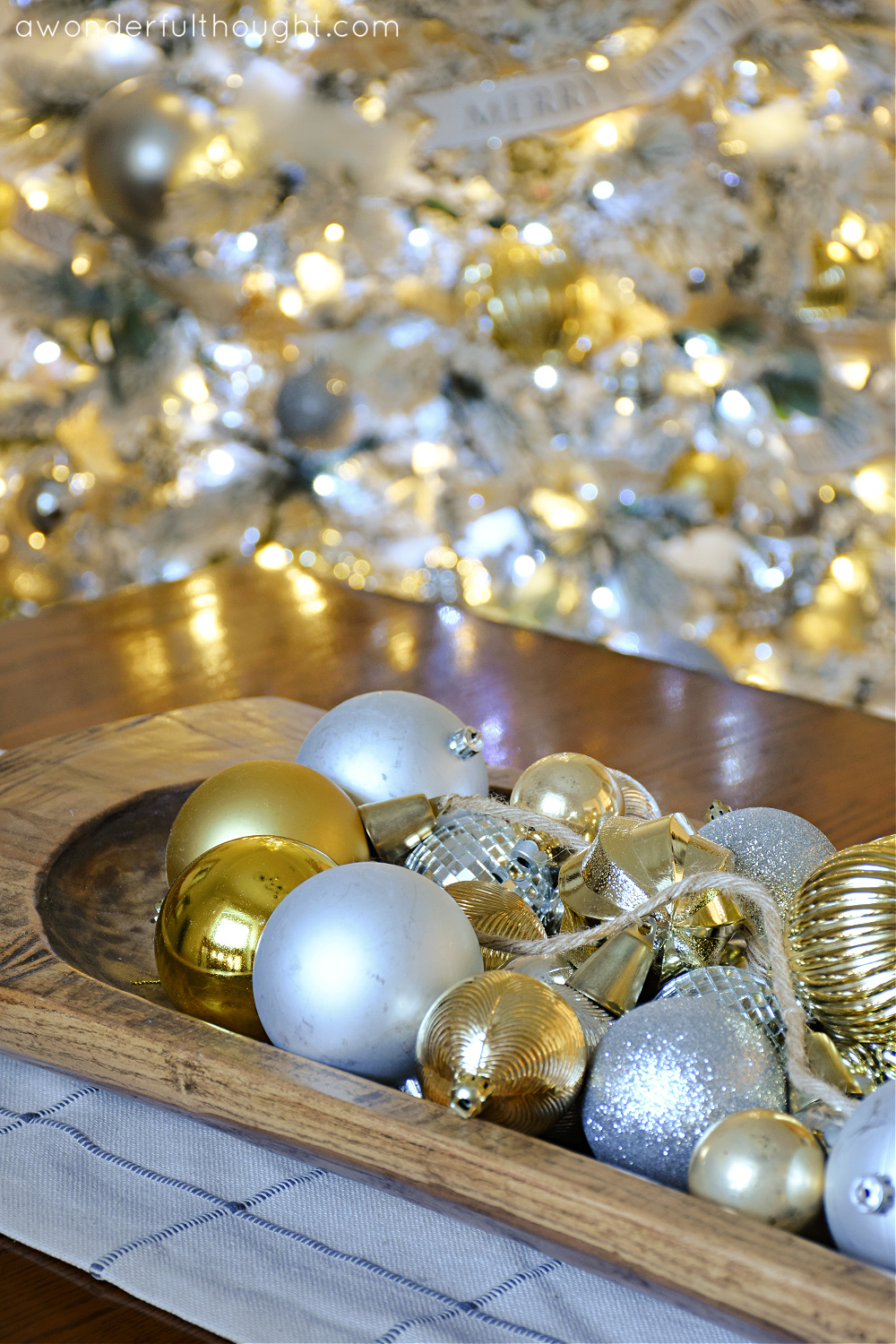 Showcase gold and silver ornaments in a wooden bowl Showcase gold and silver ornaments in a wooden bowl — Gold Christmas Decor