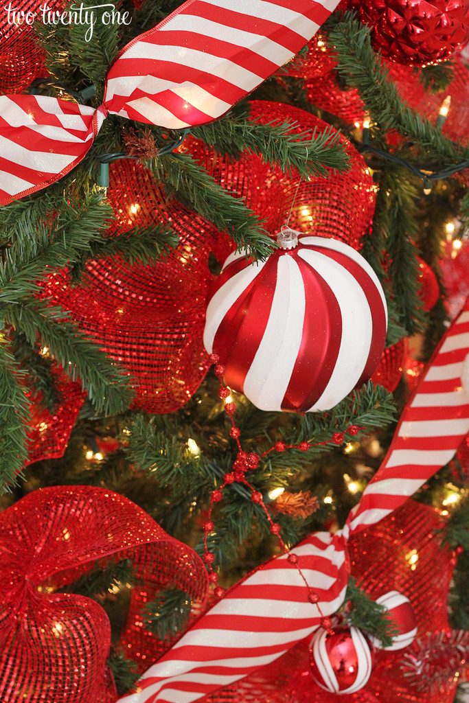 Traditional Christmas Tree Detail with Red and White Striped Ribbon and Mesh Traditional Christmas Tree Detail with Red and White Striped Ribbon and Mesh — Red and White Christmas Tree