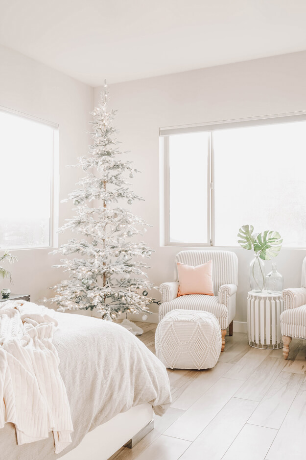 Modern Master Bedroom with Frosted Christmas Tree and Striped Armchair — Modern Christmas Decor