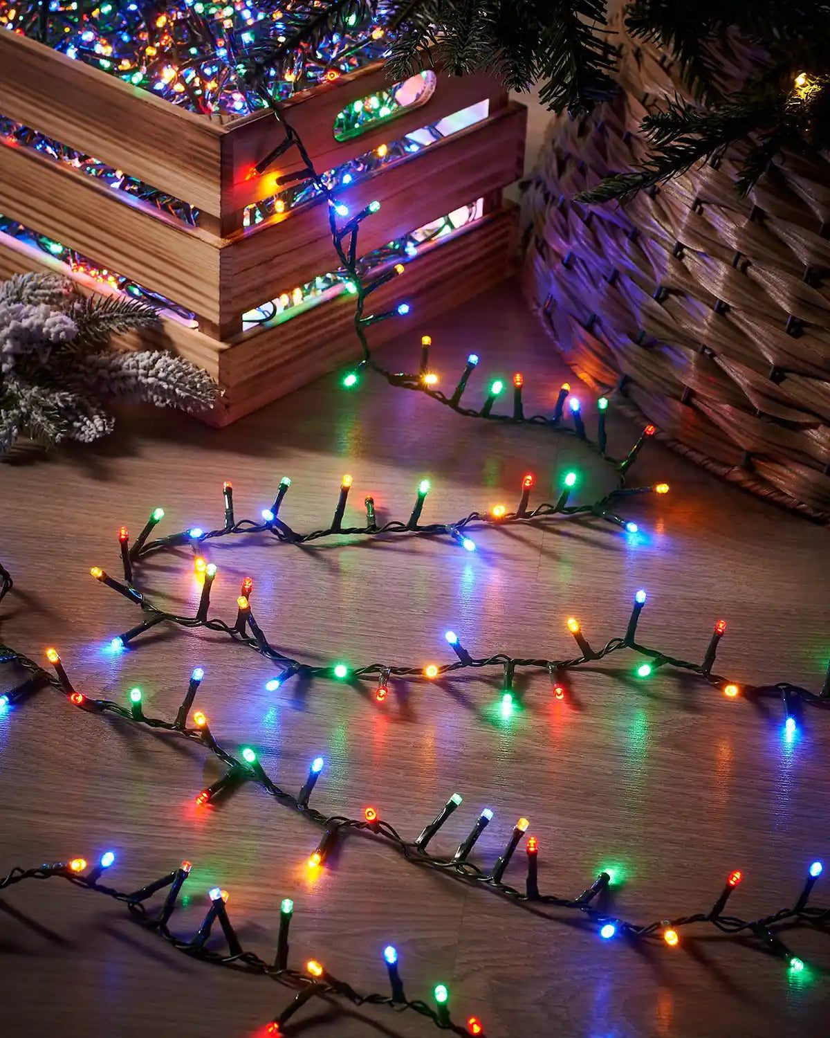 Multicolored Compact LED String Lights Spilling from a Wooden Crate Multicolored Compact LED String Lights Spilling from a Wooden Crate — Christmas Tree Lights