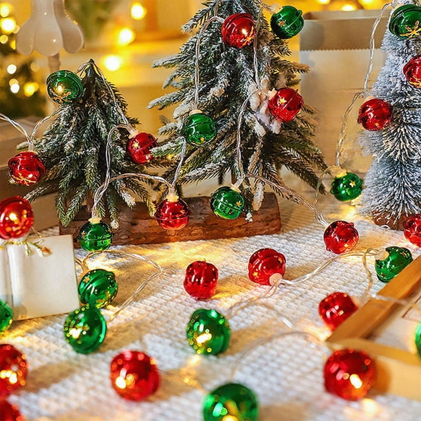 Miniature Flocked Trees with Bell Ornaments on String Lights Miniature Flocked Trees with Bell Ornaments on String Lights — Christmas Tree Lights