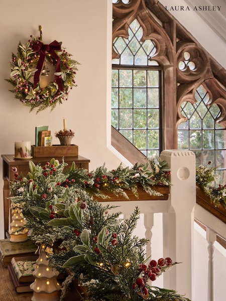 Frosted Garland with Berries and Lights on a Staircase Landing Frosted Garland with Berries and Lights on a Staircase Landing — Christmas Garland