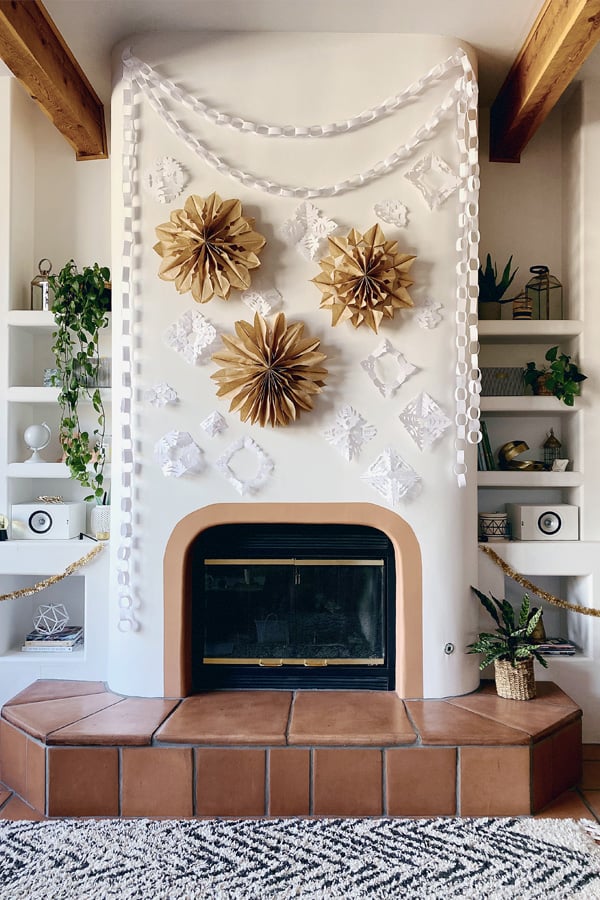 Southwestern Fireplace Mantel With Paper Snowflakes