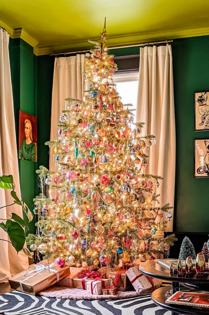 Festive Living Room with Centerpiece Vintage Christmas Tree and Zebra Rug