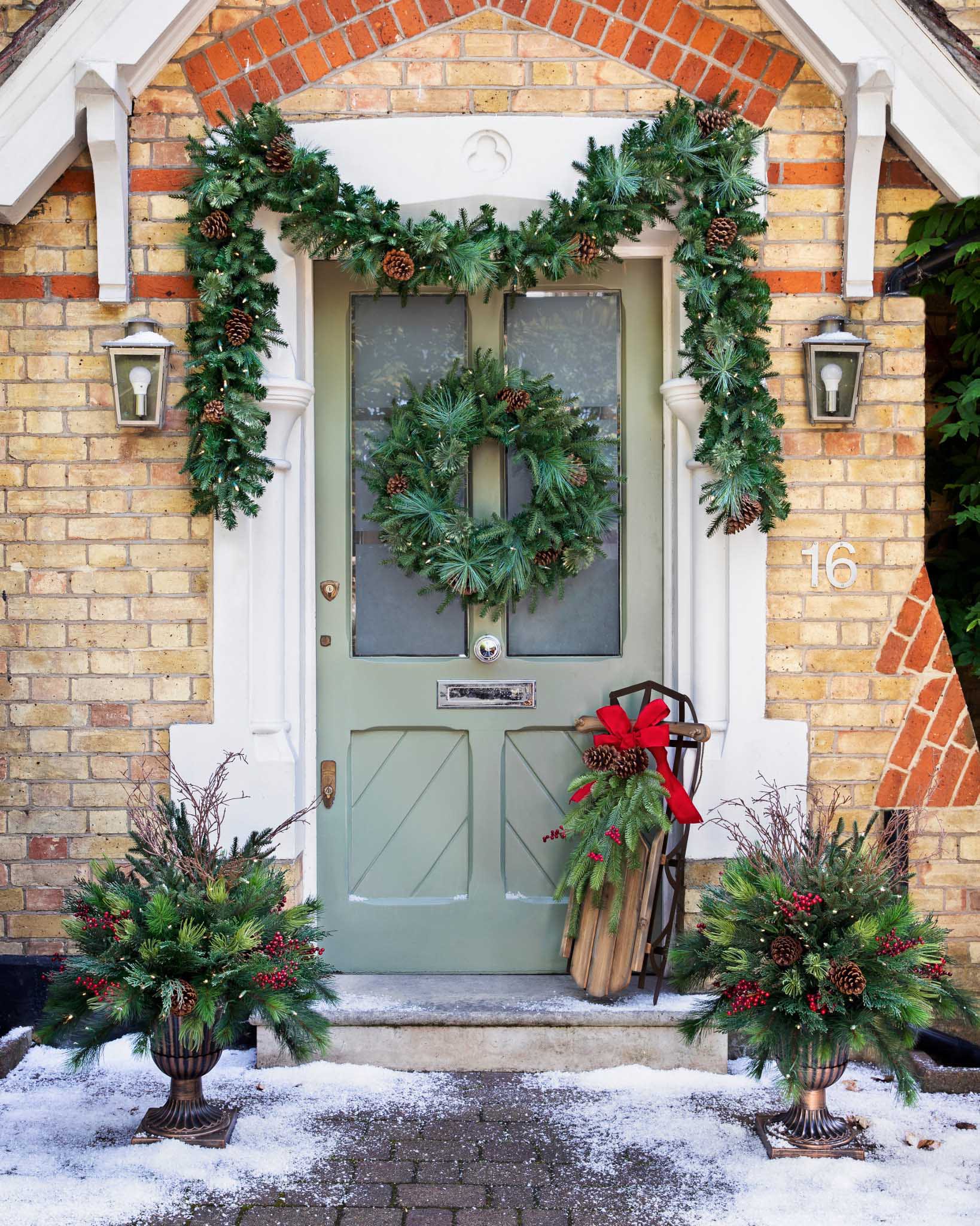 Sage Green Door with Pinecone Wreath and Rustic Sled Accent Sage Green Door with Pinecone Wreath and Rustic Sled Accent — Christmas Front Door Decor