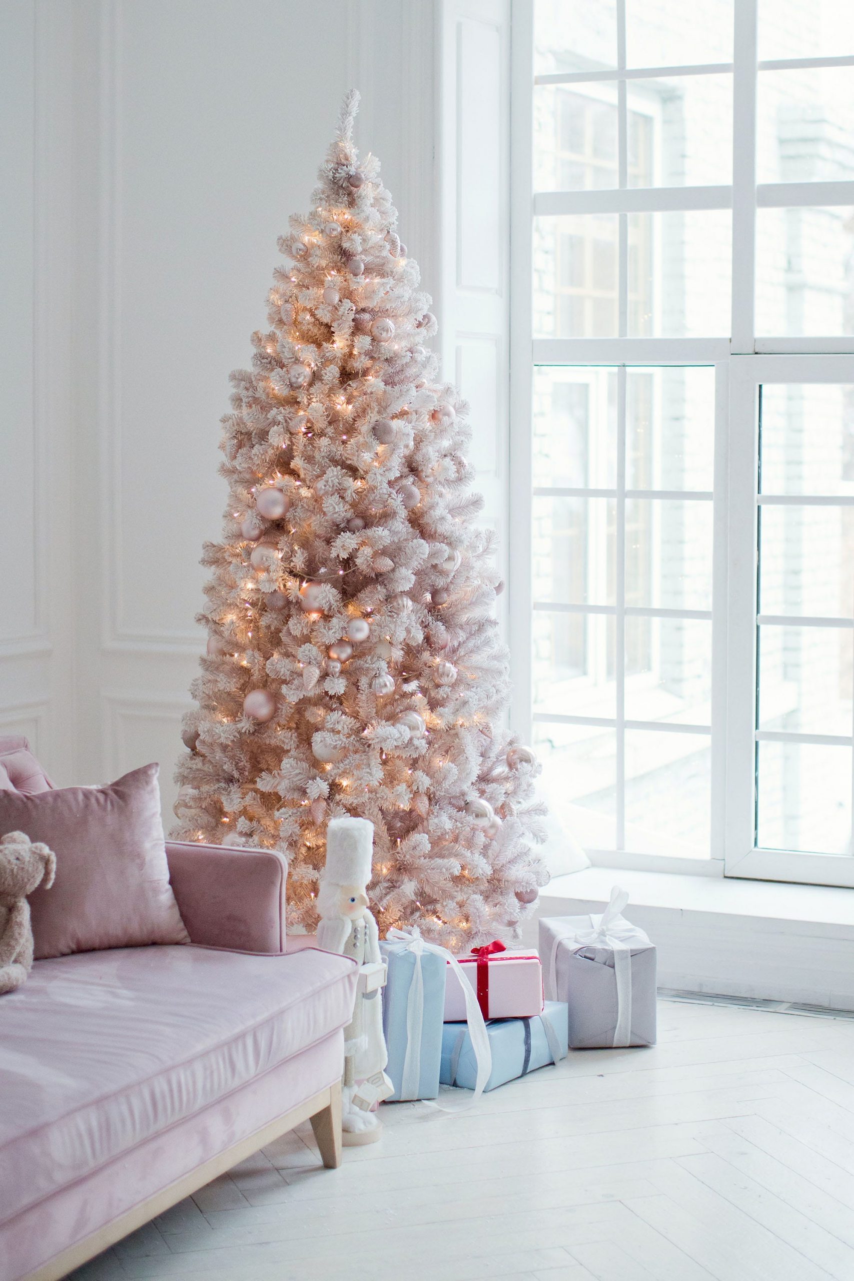 Minimalist Living Room Centered Around a Pink Flocked Christmas Tree and Sofa Minimalist Living Room Centered Around a Pink Flocked Christmas Tree and Sofa — Pink Christmas Decor
