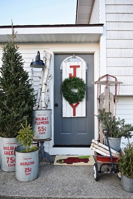 Symmetrical Rustic Porch Decor with Metal Buckets and Sled Symmetrical Rustic Porch Decor with Metal Buckets and Sled — Small Christmas Porch