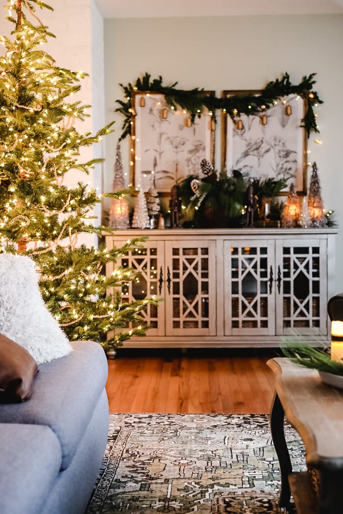 Ornate Farmhouse Sideboard Decorated with Christmas Garland and Lights Ornate Farmhouse Sideboard Decorated with Christmas Garland and Lights — Farmhouse Christmas Decor