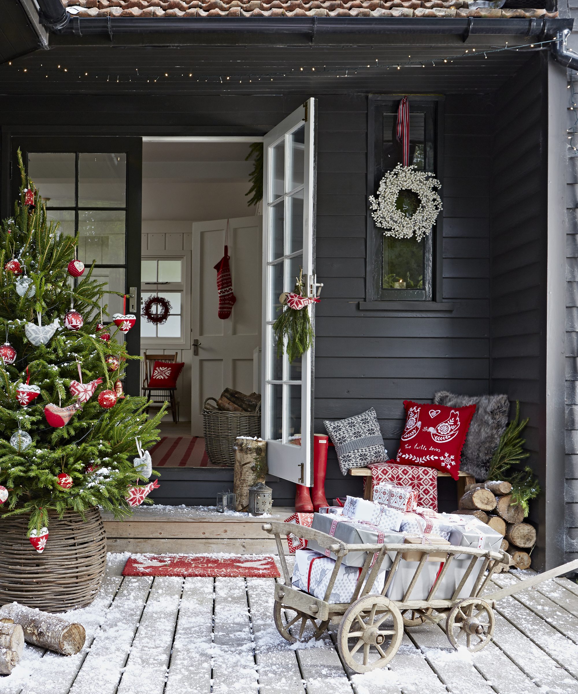 Cozy Scandi Porch with Decorated Tree and Gift Cart — Christmas House Exterior Decor