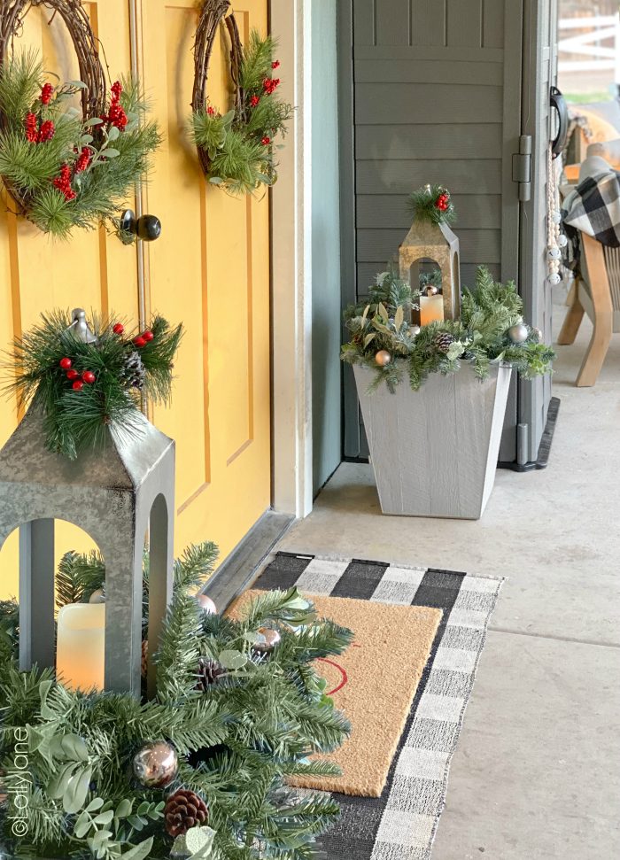 Farmhouse Porch Vignette Featuring a Silver Lantern and Buffalo Check Rug — Christmas Porch Lanterns