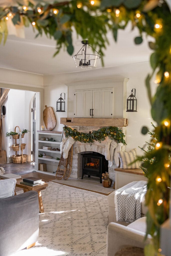 Stone Fireplace with Vintage Snowshoes and Christmas Stockings Stone Fireplace with Vintage Snowshoes and Christmas Stockings — Farmhouse Christmas Decor