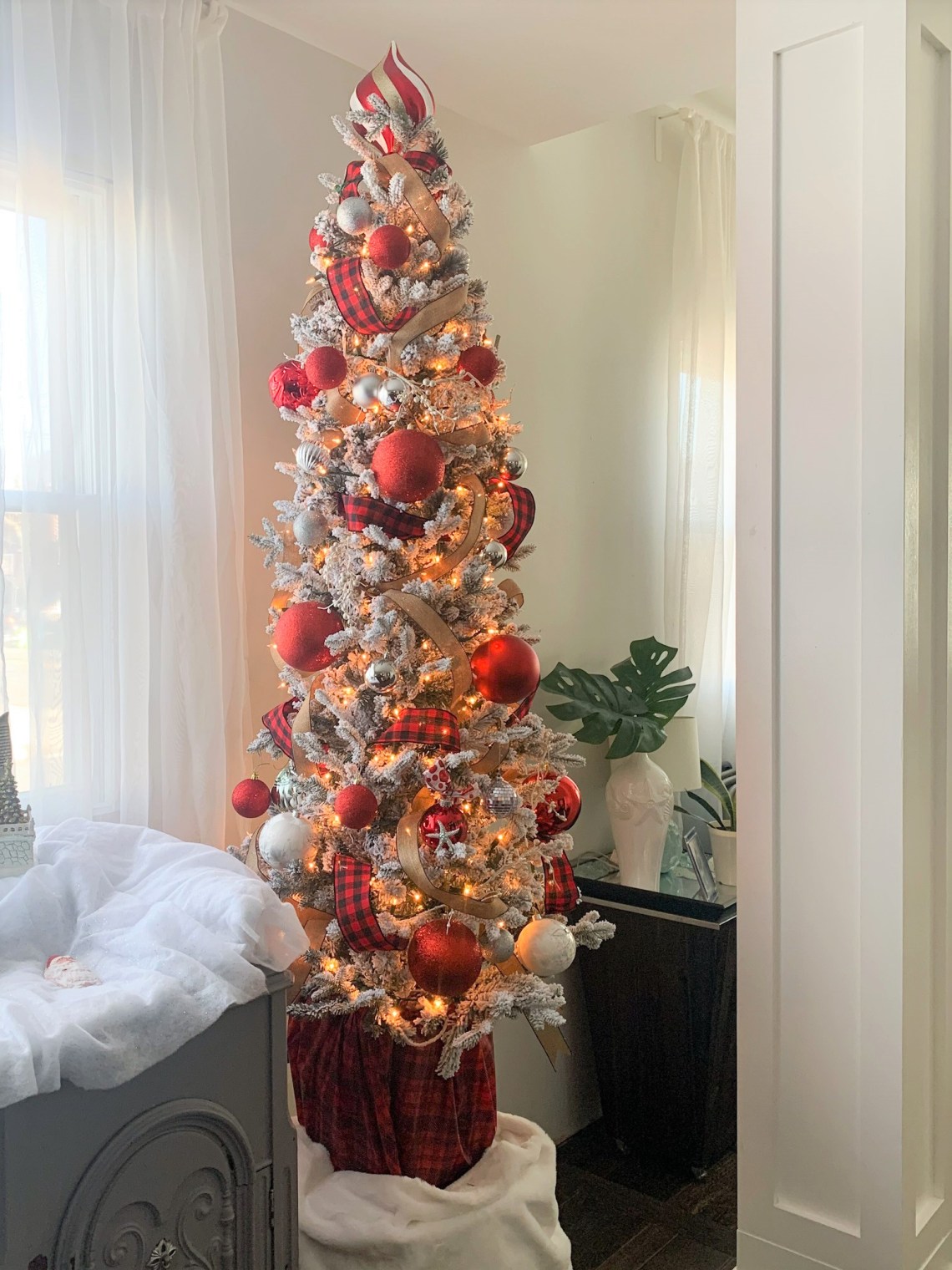 Farmhouse Slim Flocked Tree with Red and Plaid Accents — Slim Christmas Tree Decor