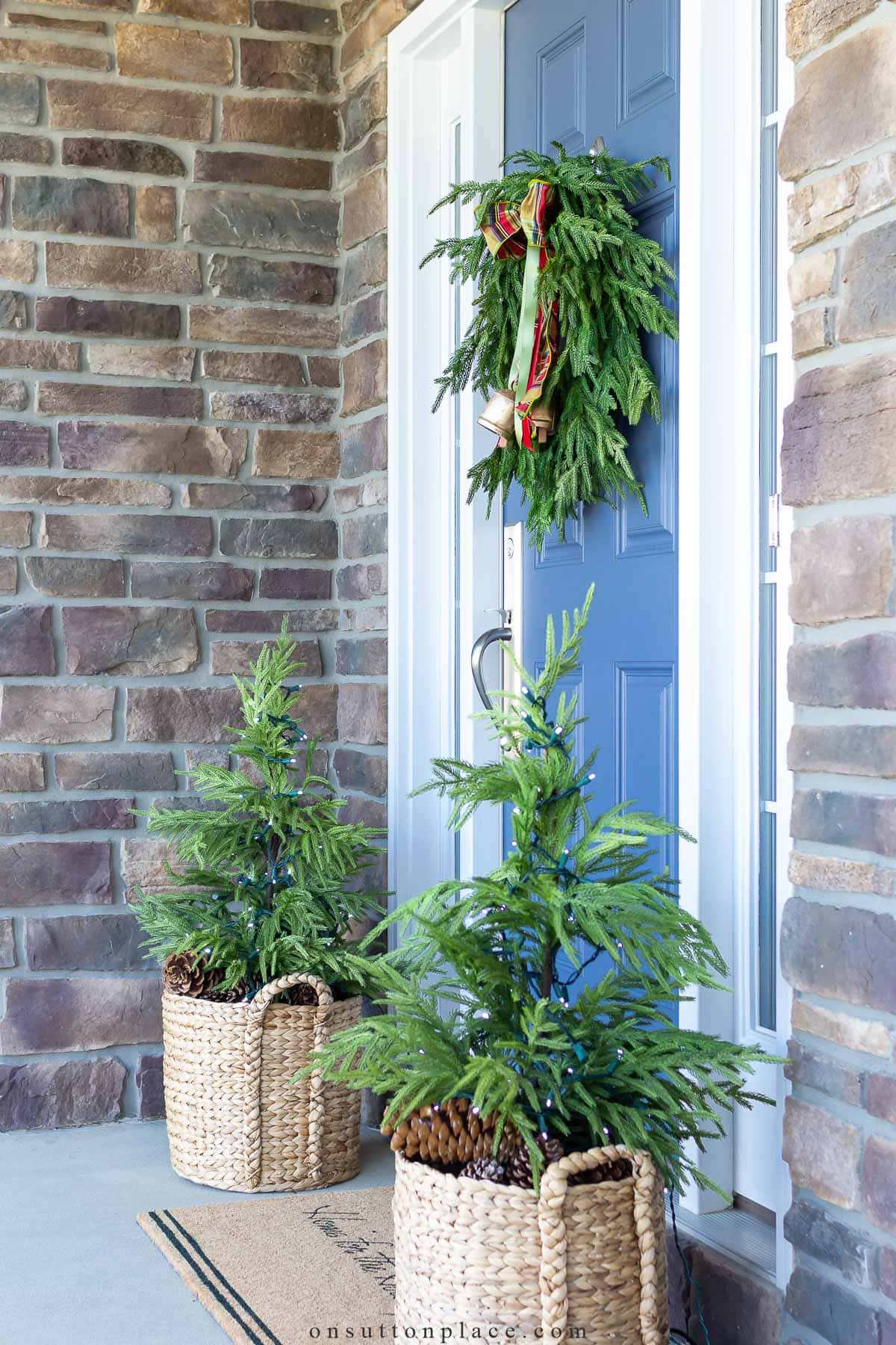 Vibrant Blue Door with Festive Wreath and Mini Trees Vibrant Blue Door with Festive Wreath and Mini Trees — Small Christmas Porch