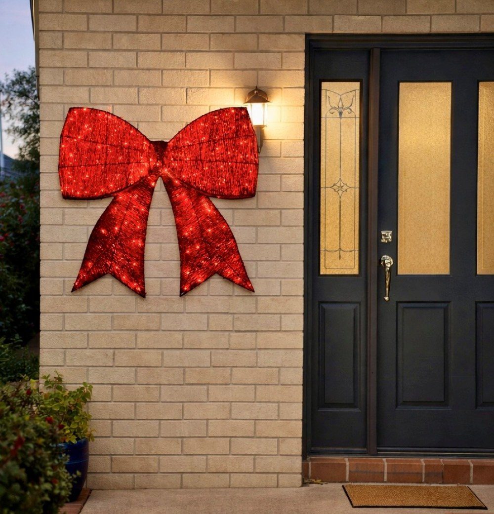 Oversized Illuminated Red Bow as Exterior Focal Point Oversized Illuminated Red Bow as Exterior Focal Point — Christmas Light Display Ideas