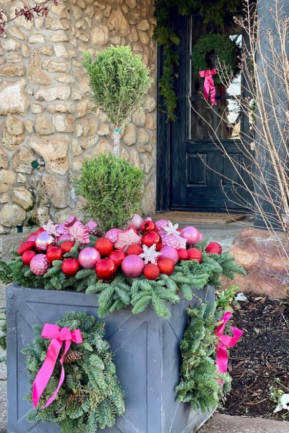Whimsical Porch Planter with Pink Ribbons and Ornaments Whimsical Porch Planter with Pink Ribbons and Ornaments — Christmas Porch Planters
