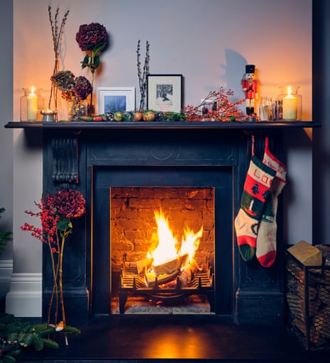 Black Mantel with Festive Stockings and Nutcracker Black Mantel with Festive Stockings and Nutcracker — Christmas Fireplace Decor
