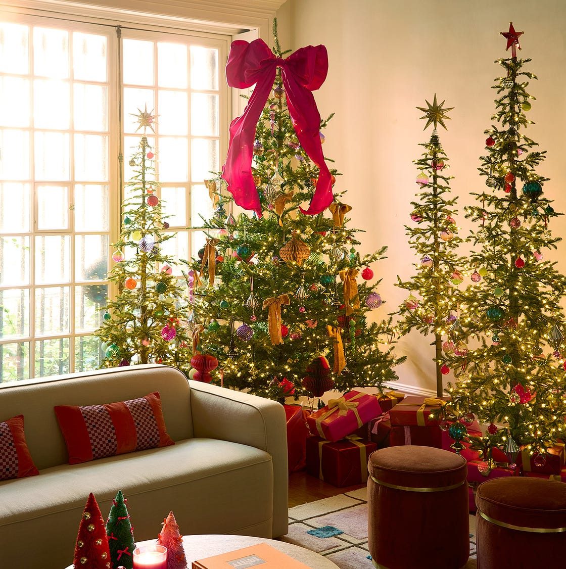 A Trio of Christmas Trees with a Bold Pink Bow Accent A Trio of Christmas Trees with a Bold Pink Bow Accent — Whimsical Christmas Decor
