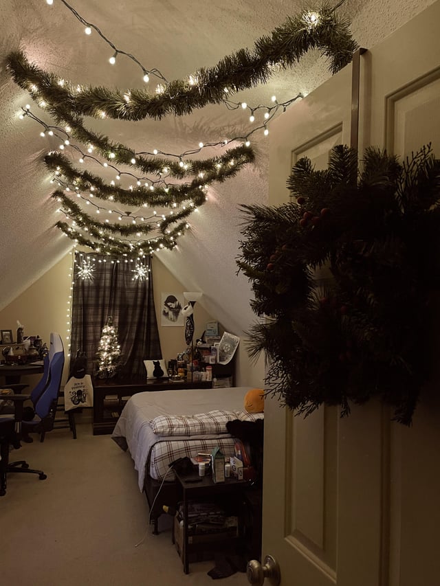 Cozy Attic Bedroom Adorned with Fairy Lights and Garland Cozy Attic Bedroom Adorned with Fairy Lights and Garland — Christmas Fairy Lights Ceiling