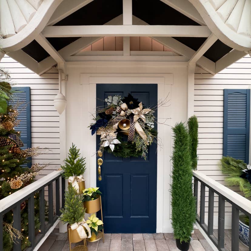 Navy Blue Door with Ornate Wreath and Gold Bell Accents Navy Blue Door with Ornate Wreath and Gold Bell Accents — Christmas Front Door Decor
