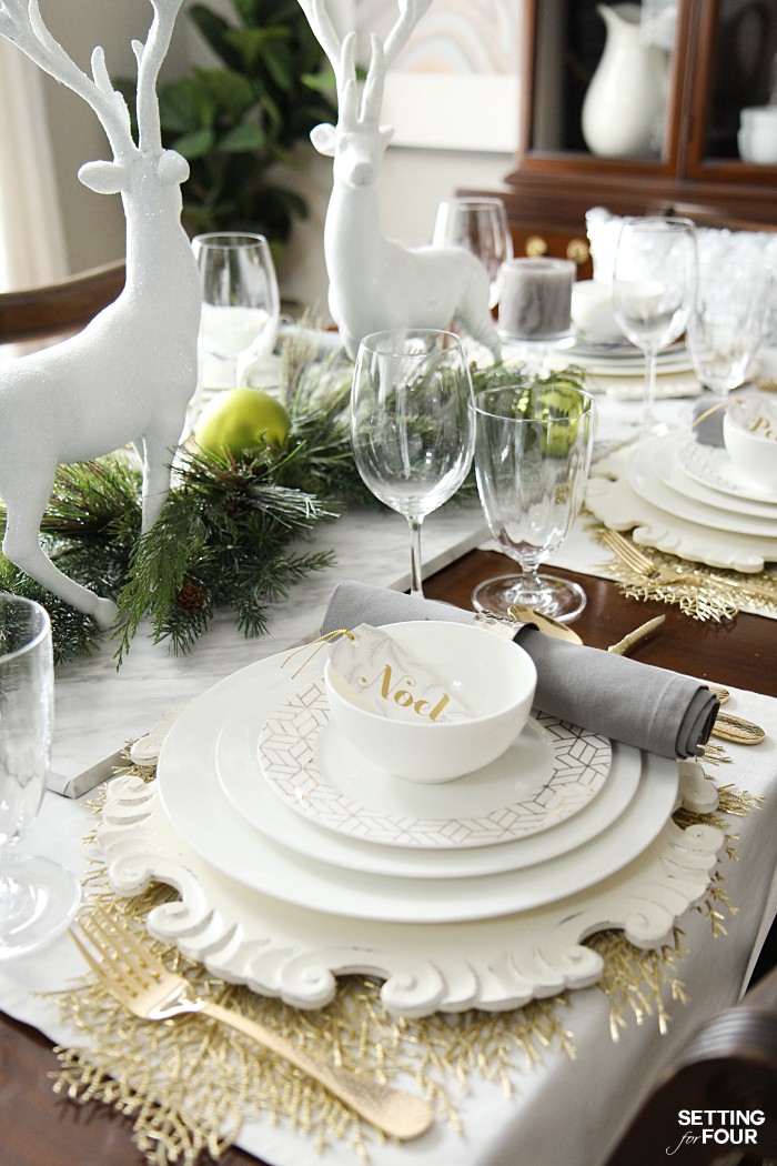 White Reindeer Figures and Gold Snowflake Chargers for an Elegant Holiday Table White Reindeer Figures and Gold Snowflake Chargers for an Elegant Holiday Table — Elegant Christmas Table Setting