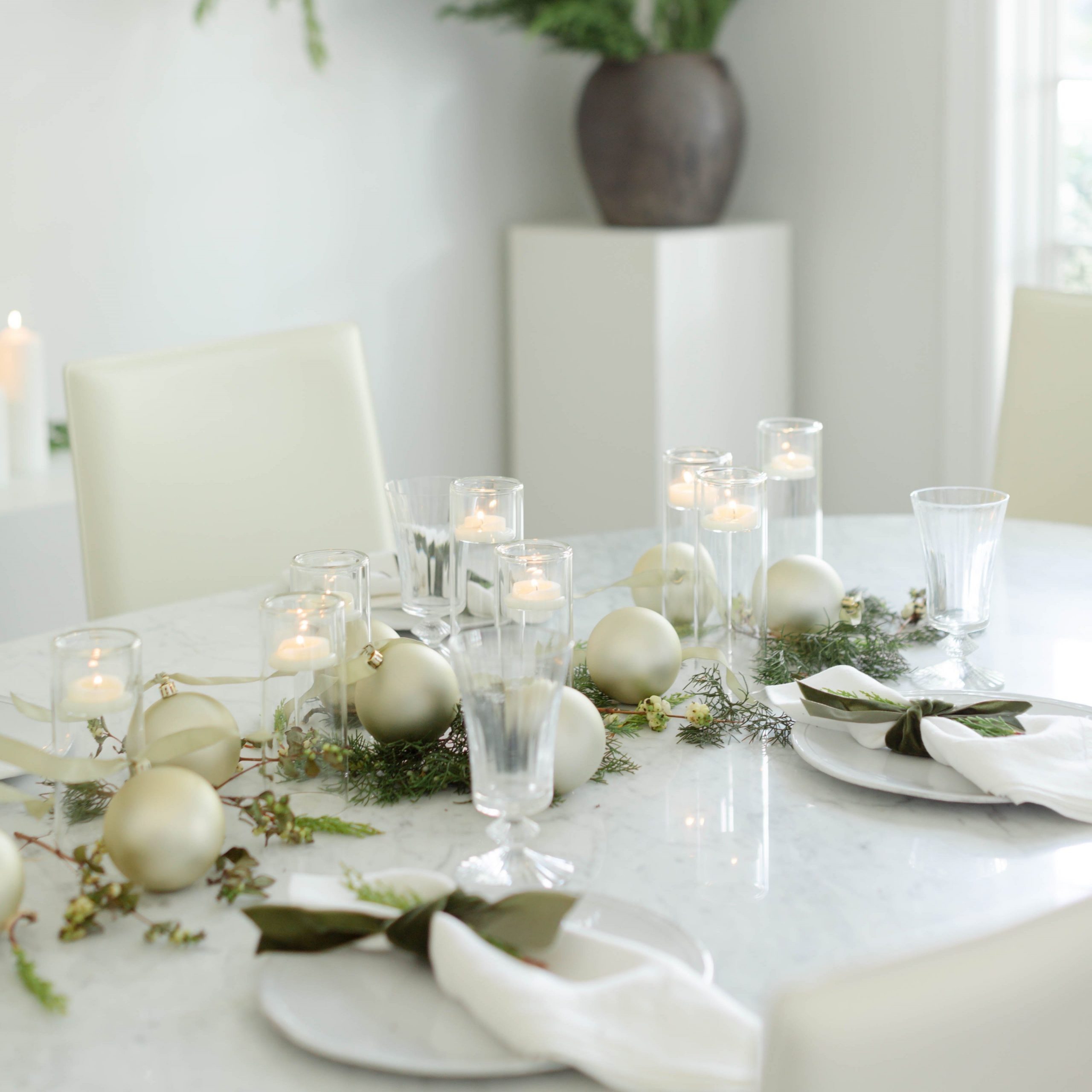 Minimalist Evergreen and Gold Ornament Centerpiece on Marble Minimalist Evergreen and Gold Ornament Centerpiece on Marble — Simple Christmas Centerpiece