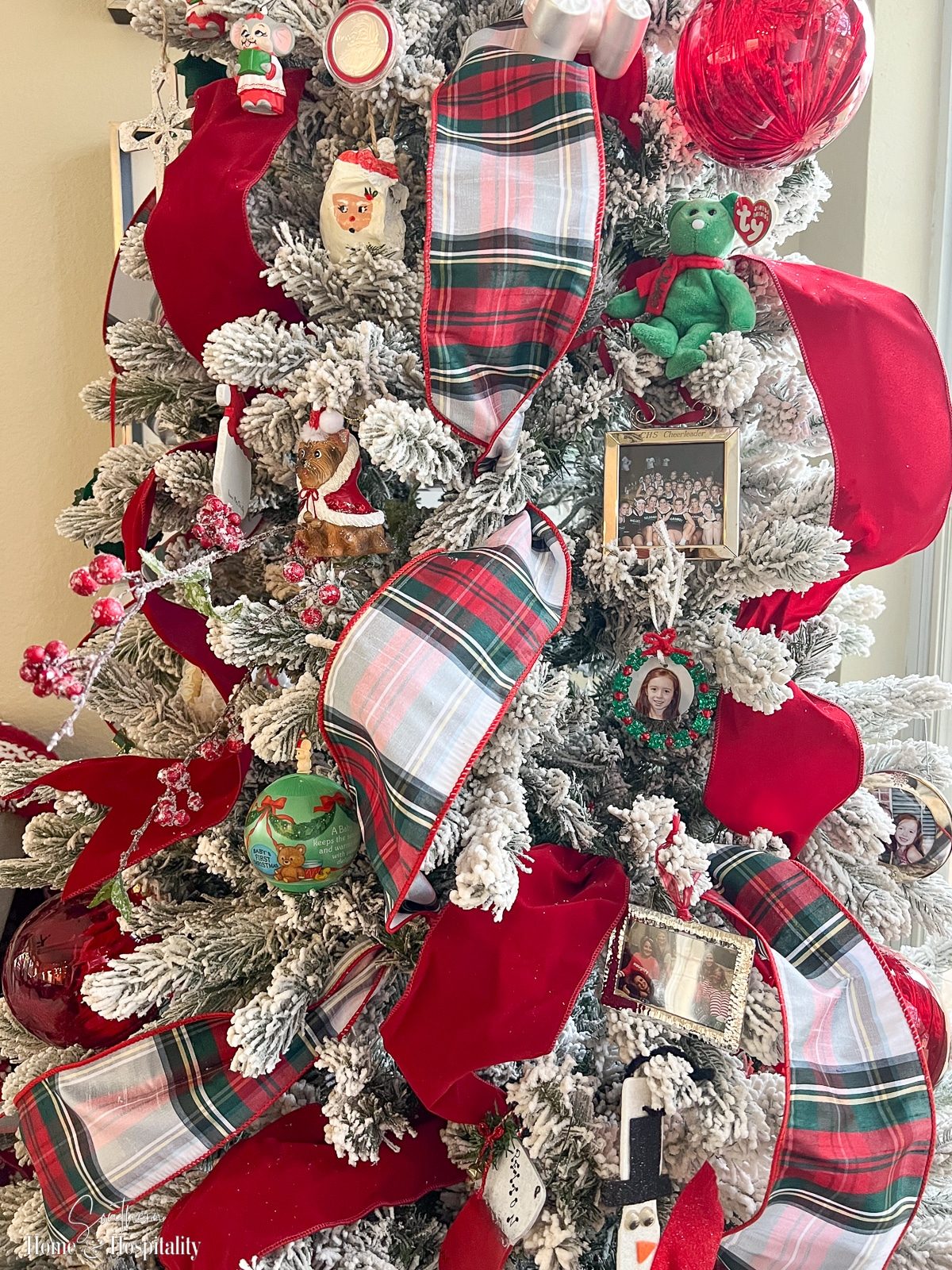 Flocked Christmas Tree with Red Ribbons, Plaid Bows, and Figurines Flocked Christmas Tree with Red Ribbons, Plaid Bows, and Figurines — Ornament Christmas Tree