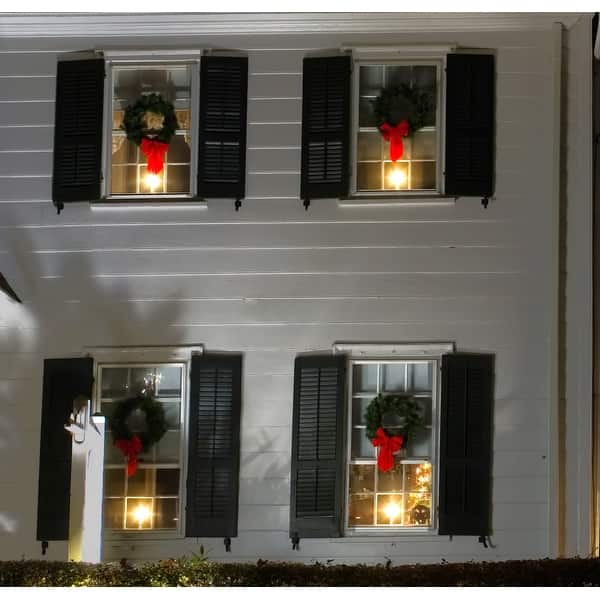 Exterior View: Classic Facade with Wreaths and Window Candles — Christmas Window Candles