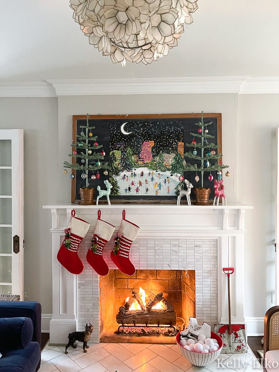 Fireplace and Mantle with Vintage Artwork and Stockings — Vintage Christmas Decor