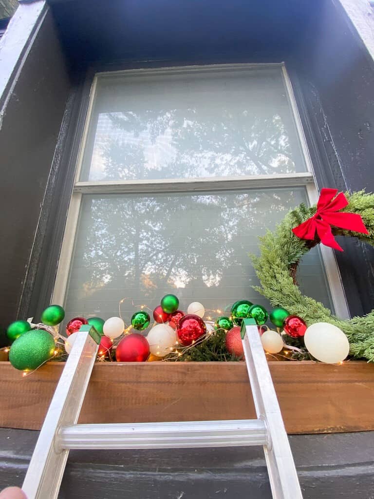 Covered Porch with Multiple Simple Green Wreaths and Planters — Christmas Window Decor Outdoor