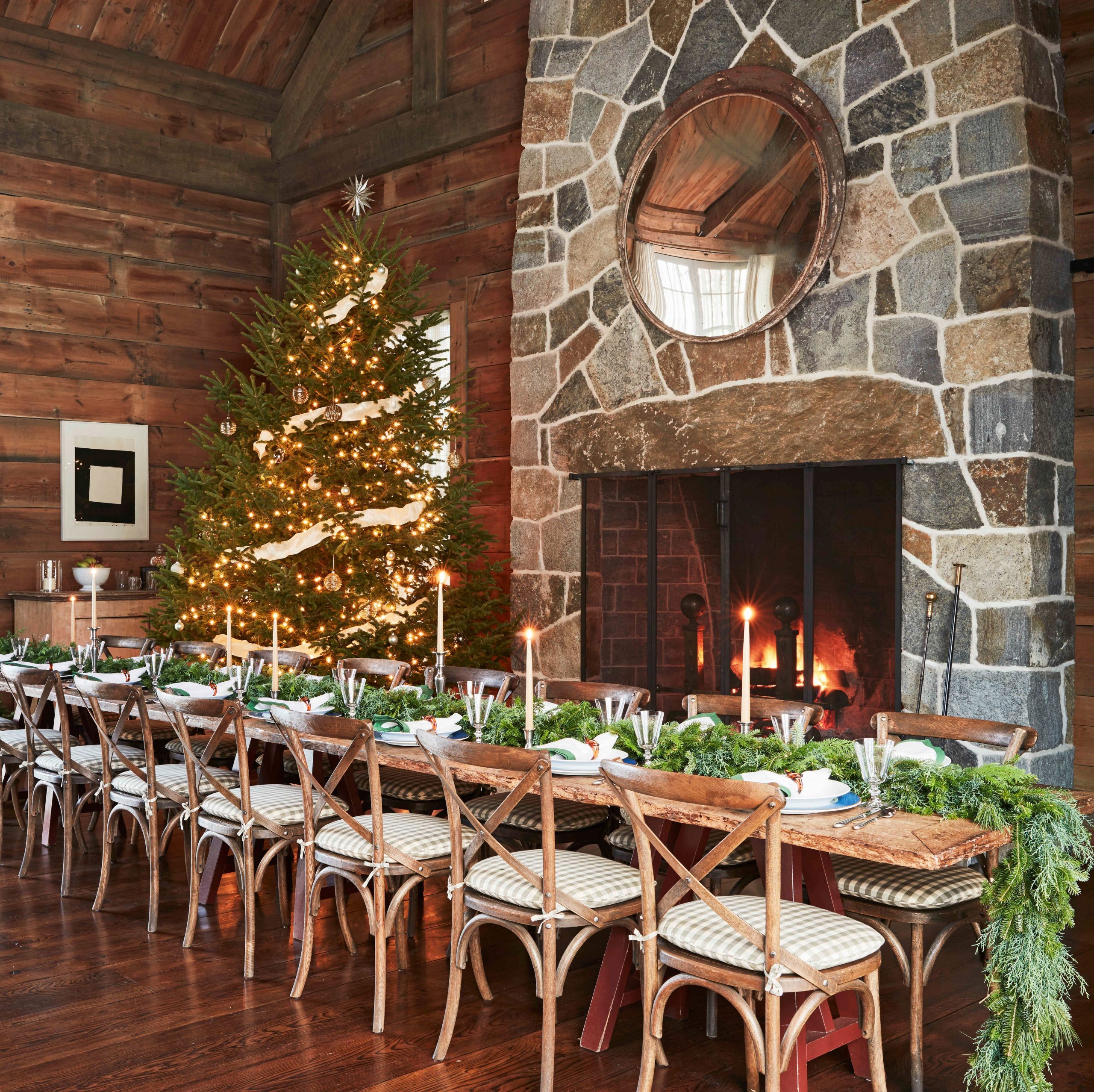 Rustic Lodge Dining Room with Stone Fireplace and Long Table — Christmas Dining Room Decor