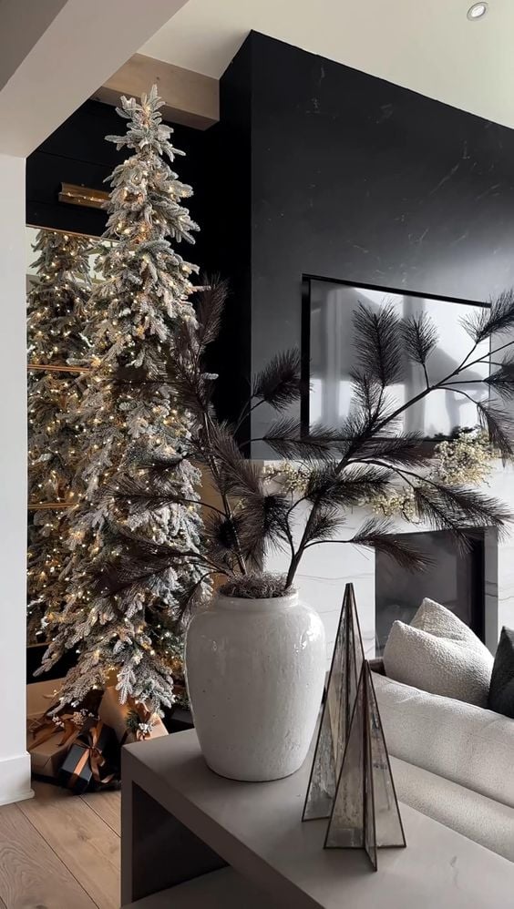 Modern Slim Flocked Tree by a Black Fireplace — Slim Christmas Tree Decor