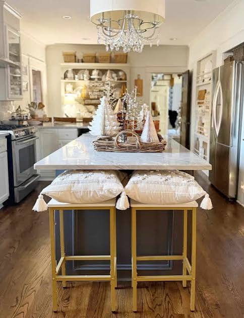 Spacious Modern Kitchen Island with Festive Trees and Chandelier Spacious Modern Kitchen Island with Festive Trees and Chandelier — Christmas Kitchen Decor