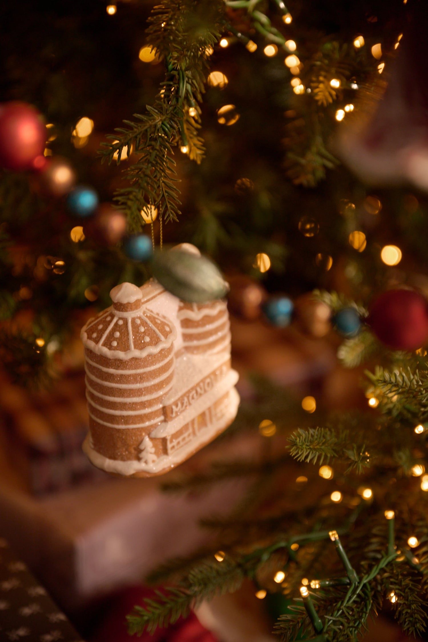 Detailed Gingerbread House Ornament on a Christmas Tree Detailed Gingerbread House Ornament on a Christmas Tree — Christmas Decor