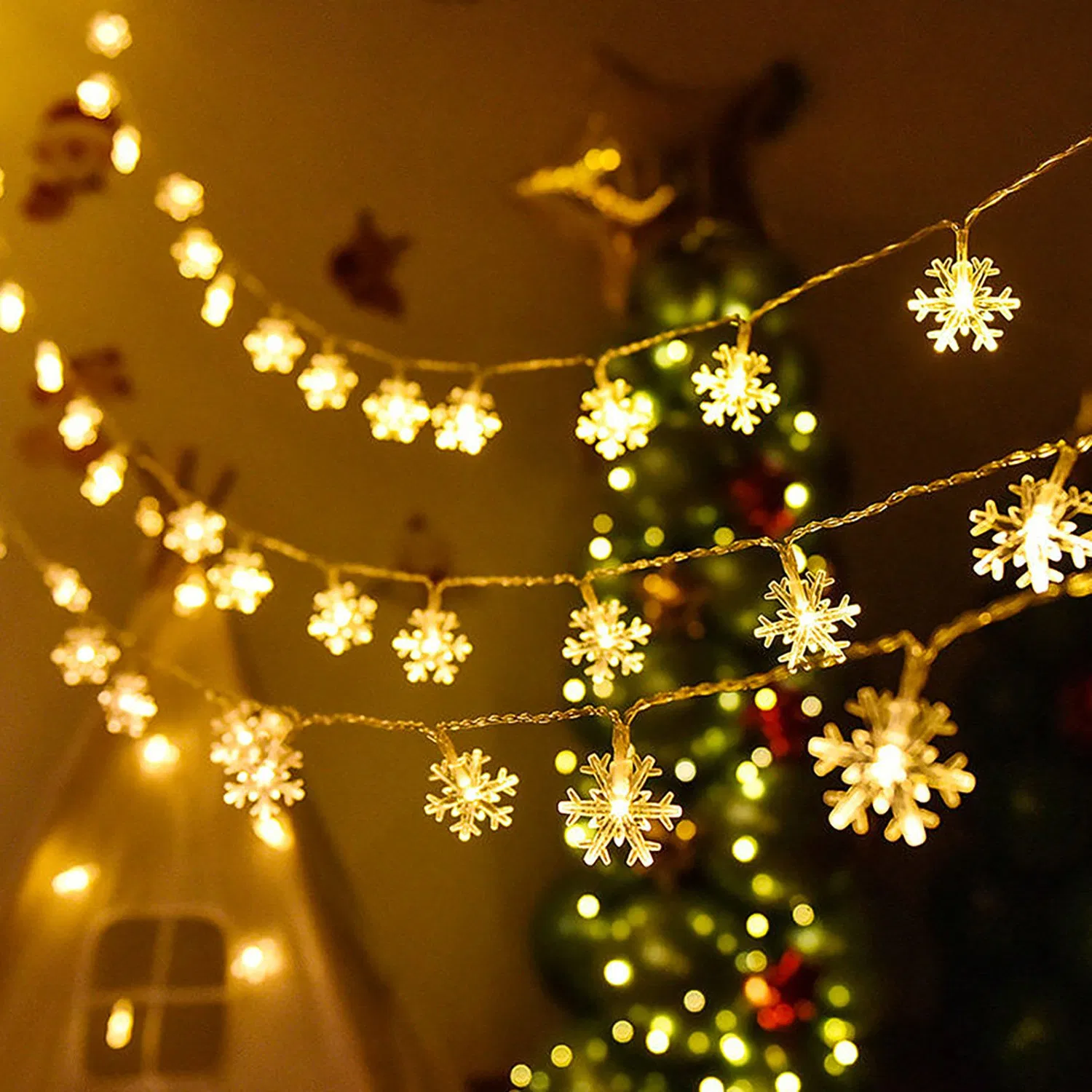 Delicate Snowflake String Lights in Festive Interior Delicate Snowflake String Lights in Festive Interior — Christmas Lights in Garland Indoor