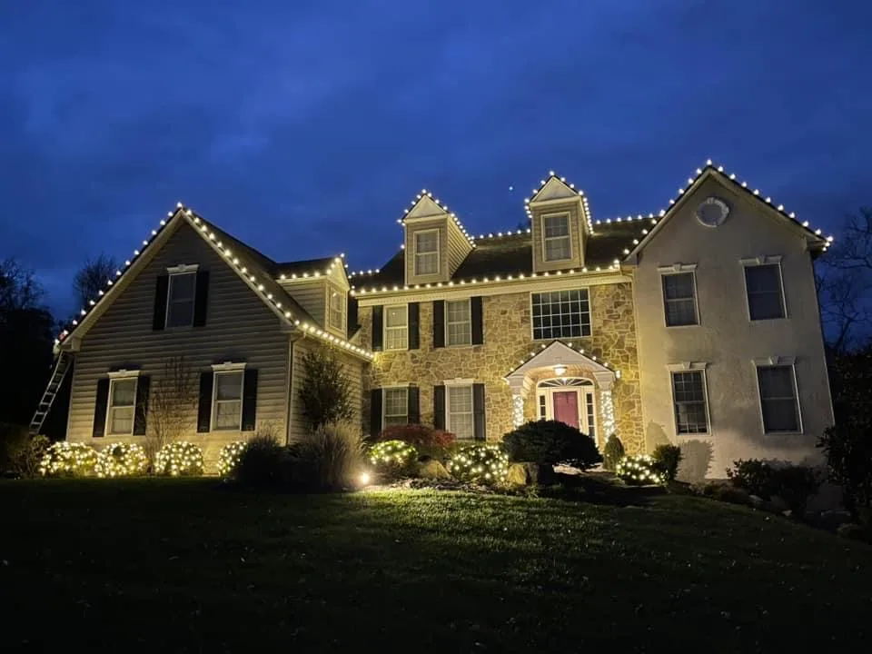 Traditional House Exterior Illuminated with White Christmas Lights — Christmas House Exterior Decor