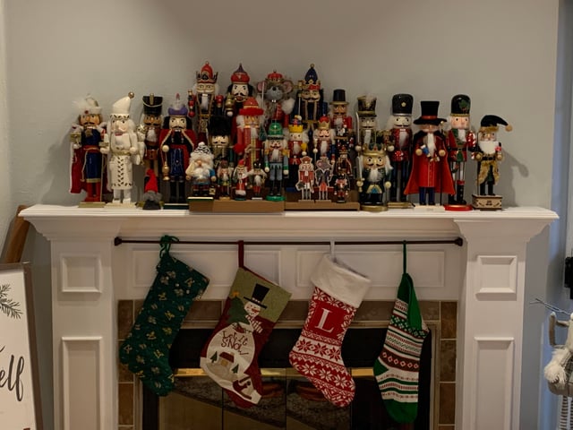 Abundant Nutcracker Display Across Fireplace Mantel