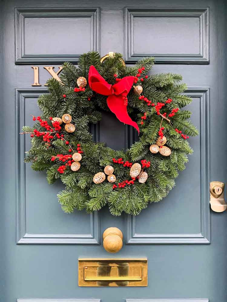 Traditional Wreath with Red Velvet Bow on Blue Door Traditional Wreath with Red Velvet Bow on Blue Door — Simple Christmas Decor
