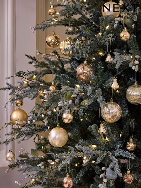Enhance your Christmas tree with varied gold baubles and lights Enhance your Christmas tree with varied gold baubles and lights — Gold Christmas Decor