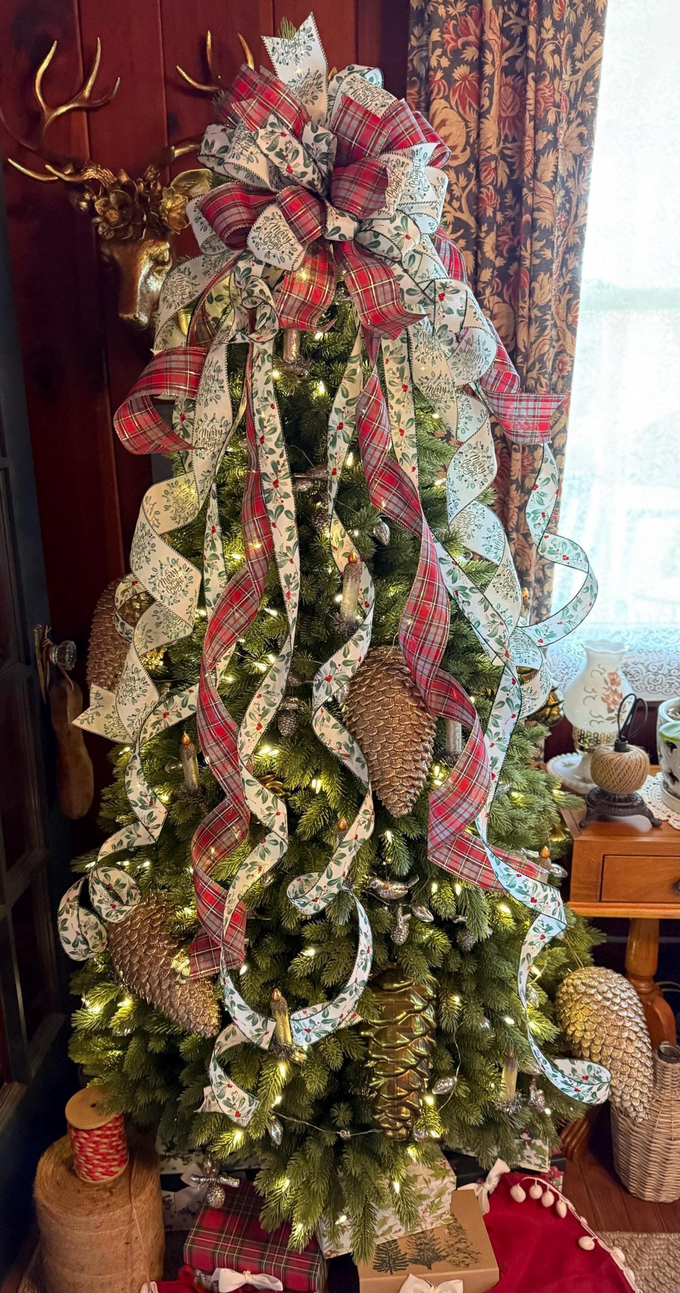 Medium Shot Traditional Living Room Christmas Tree with Pinecones — Sage Green Christmas Decor