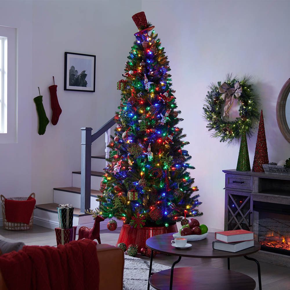 Eclectic Living Room with a Tall Decorated Christmas Tree Eclectic Living Room with a Tall Decorated Christmas Tree — Christmas Tree with Colored Lights