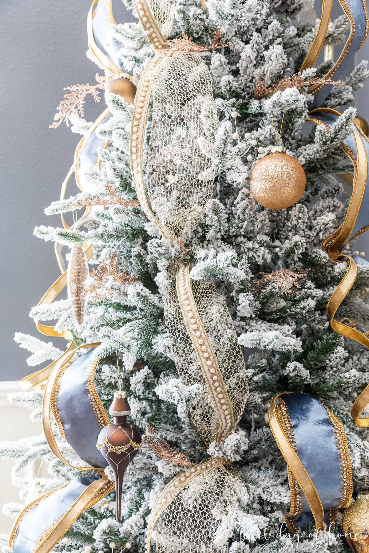 Elegant Flocked Tree with Gold, Blue, and Velvet Accents — Flocked Christmas Tree Decor