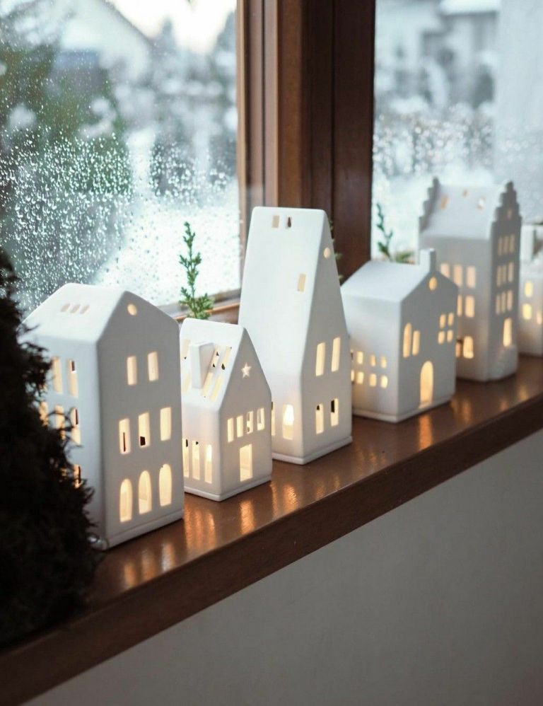 Modern White Ceramic Village on a Wooden Window Sill — Christmas Village Display