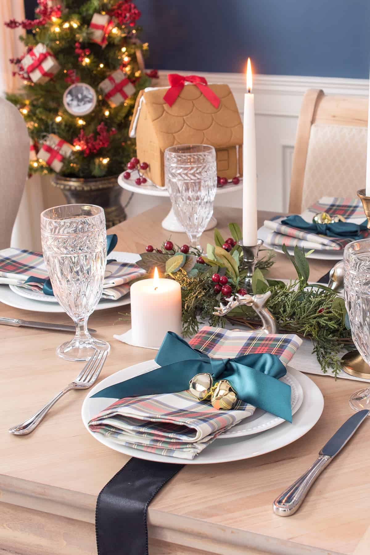 Cozy Christmas Place Setting with Tartan Napkin and Gingerbread House — Christmas Dining Room Decor