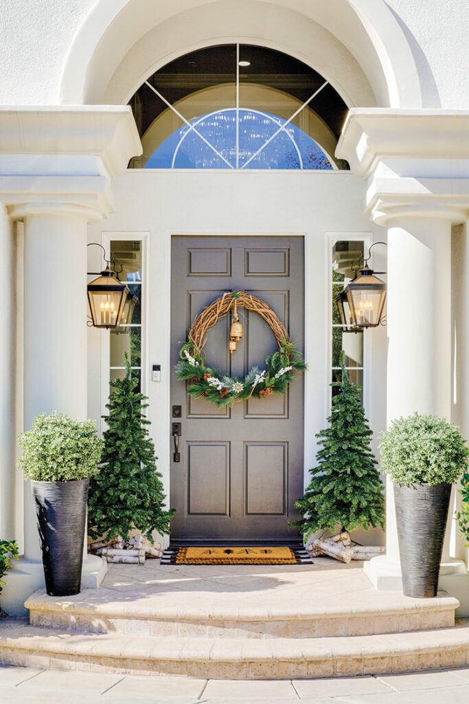 Dark Gray Front Door with Grapevine Wreath and Pine Trees Dark Gray Front Door with Grapevine Wreath and Pine Trees — Christmas Front Door Decor