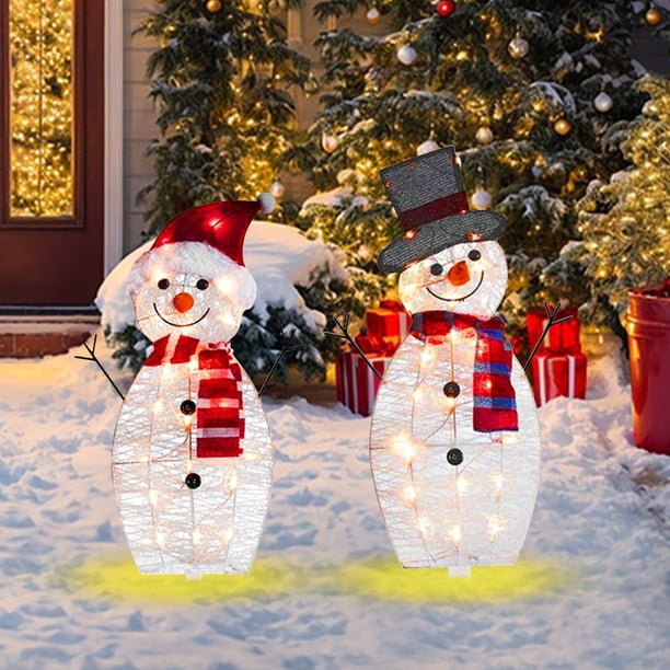 Cheery Light-Up Snowmen on Snowy Lawn Cheery Light-Up Snowmen on Snowy Lawn — Christmas Light Display Ideas