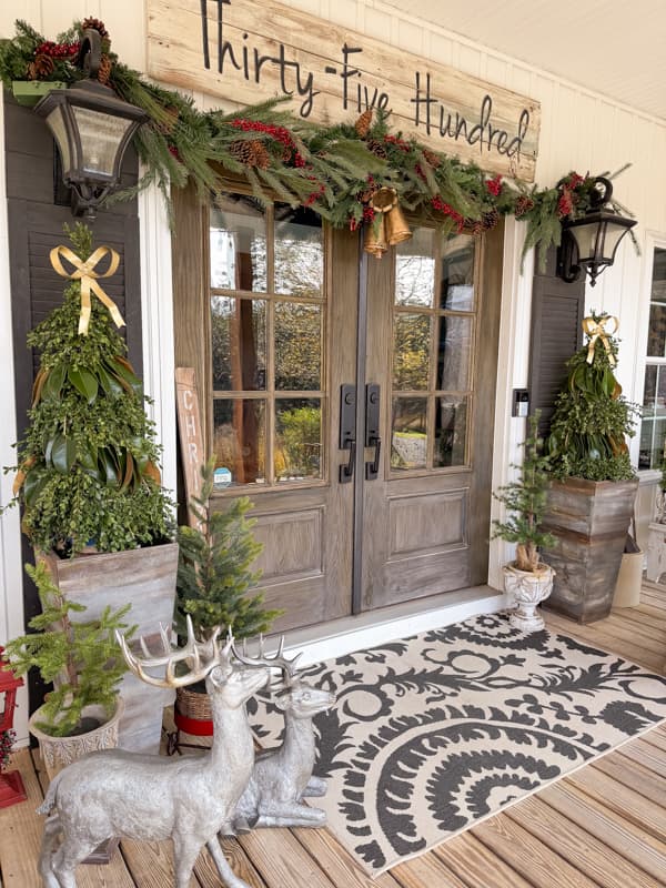 Farmhouse Porch Entrance with Decorative Deer and Sign — Christmas House Exterior Decor