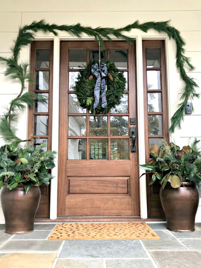 Bronze Planters with Greenery and Magnolia Leaves Bronze Planters with Greenery and Magnolia Leaves — Christmas Porch Planters
