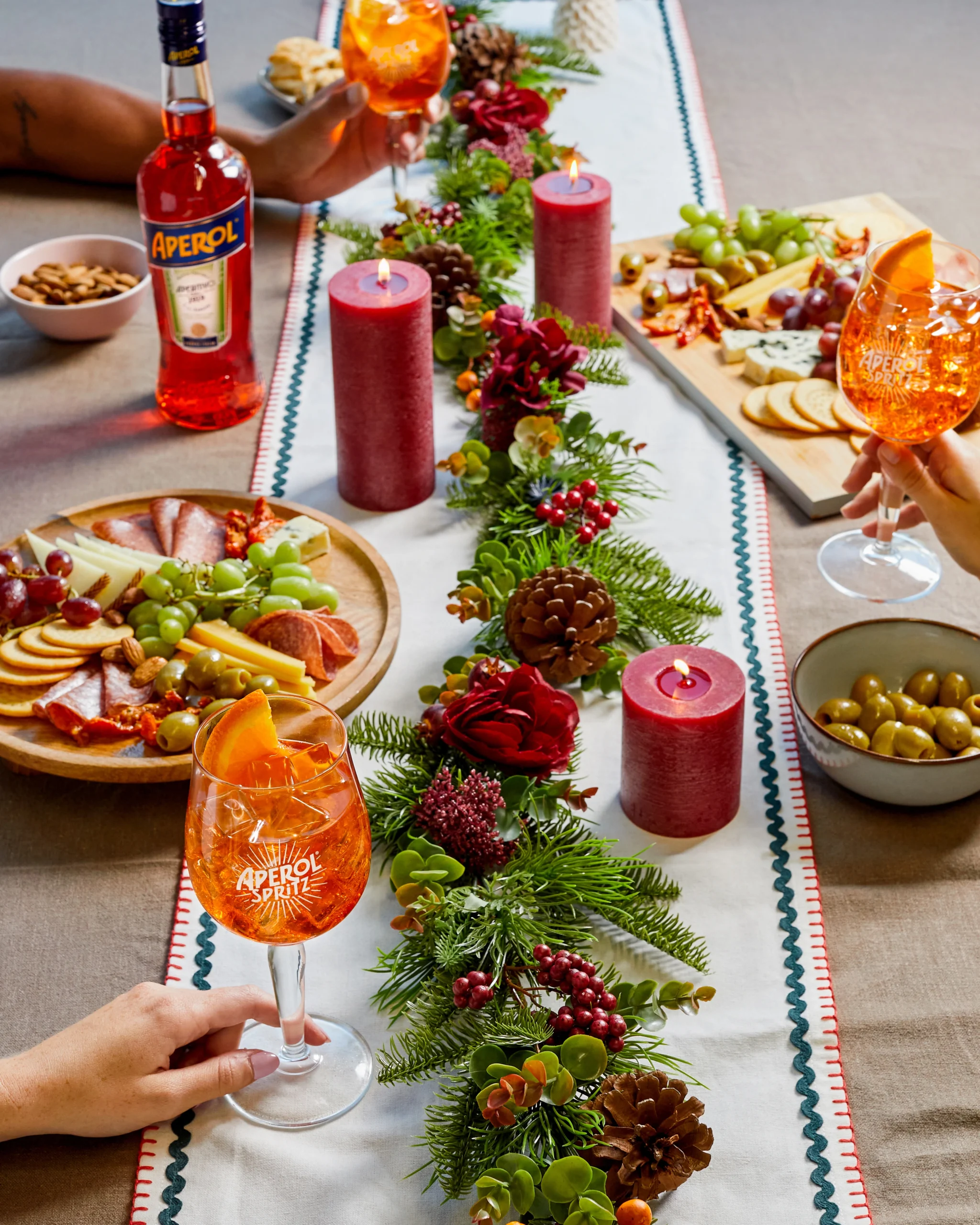 Vibrant Aperitif Spread with Festive Garland and Red Candles — Christmas Party Decor