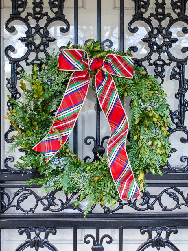 Traditional Wreath with Plaid Bow on Metal Gate Traditional Wreath with Plaid Bow on Metal Gate — DIY Christmas Wreath