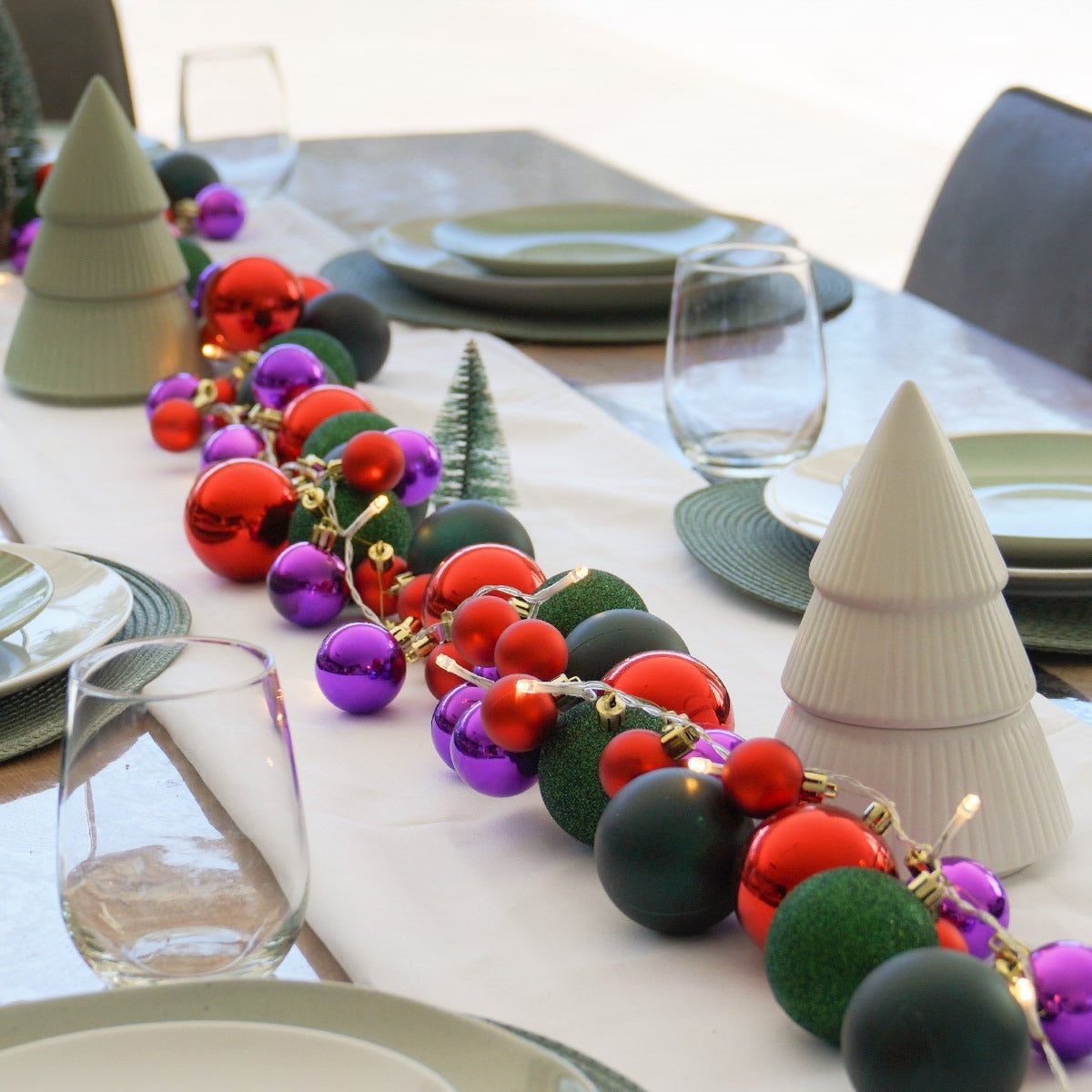 Modern Ornament Garland with Integrated Lights on Dining Table Modern Ornament Garland with Integrated Lights on Dining Table — Christmas Lights in Garland Indoor